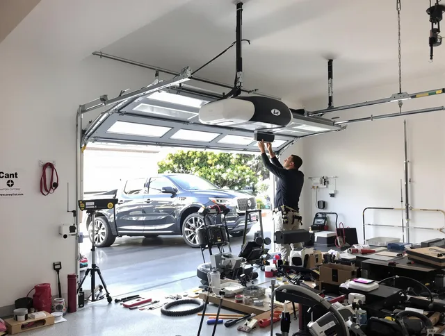 Cuyahoga Falls Garage Door Repair specialist installing smart garage door opener system in Cuyahoga Falls home