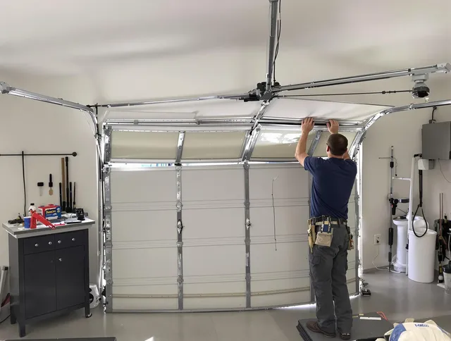 Cuyahoga Falls Garage Door Repair specialist performing precise section replacement on Cuyahoga Falls garage door